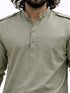 Green kurta worn by a person on a white background