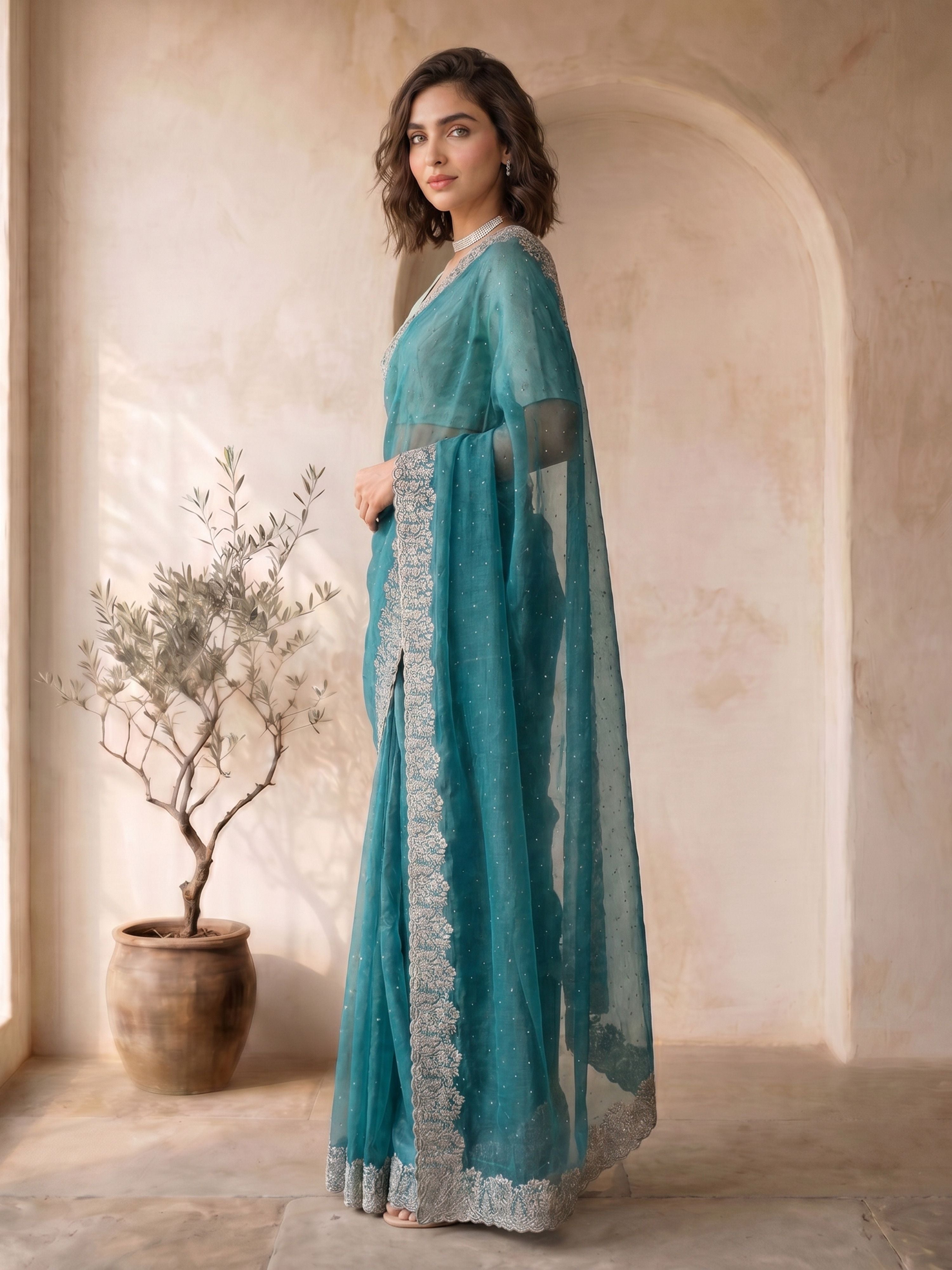 Turquoise Organza Embroidered Saree with Silver Border