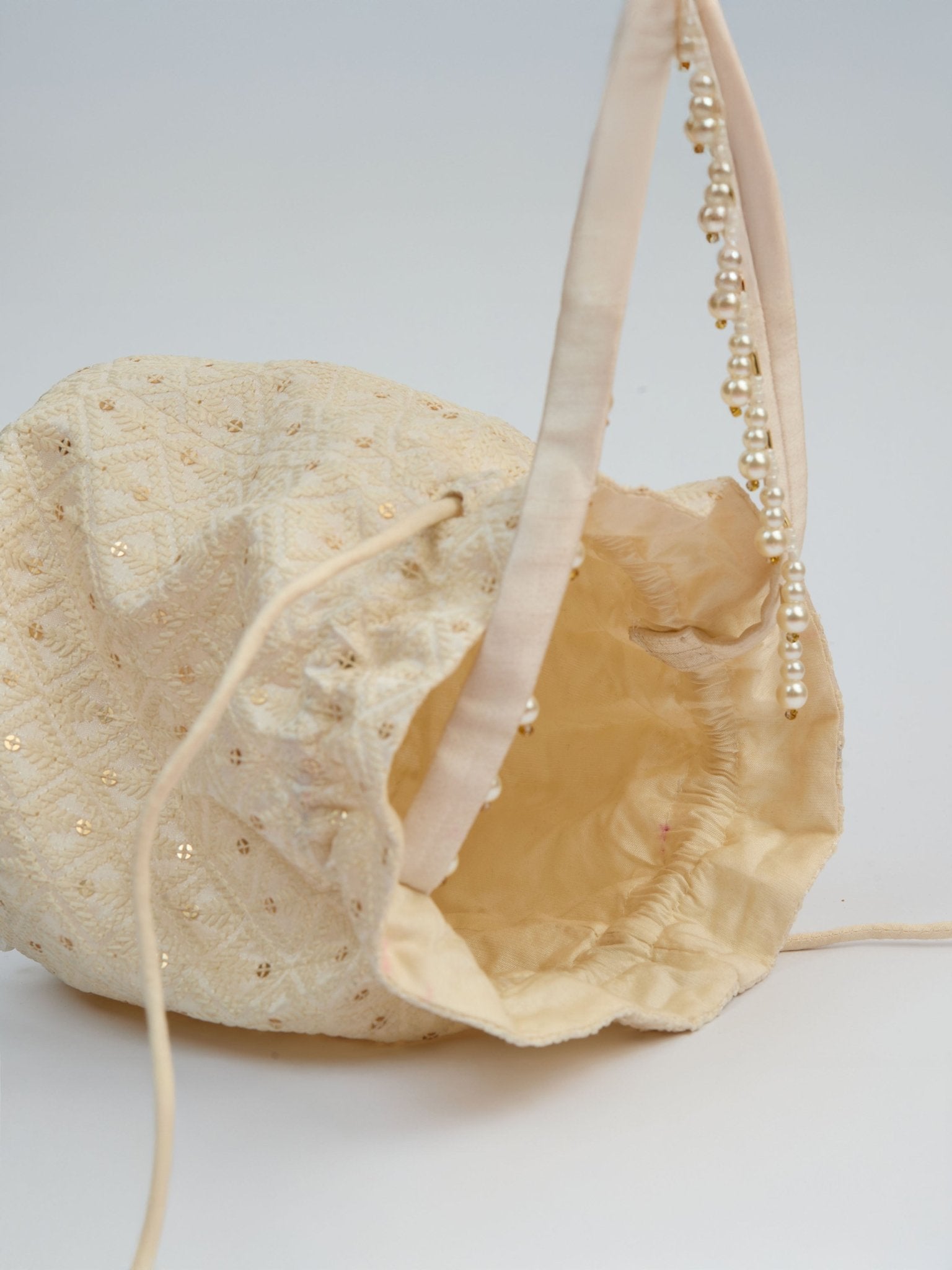 vastramayWomen's Cream Handcrafted Potli Clutch