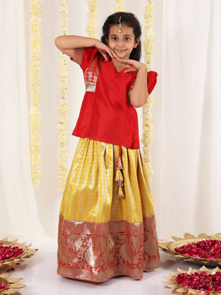 Vastramay Girl's Yellow And Maroon Pavda Pattu Lehenga Choli Set
