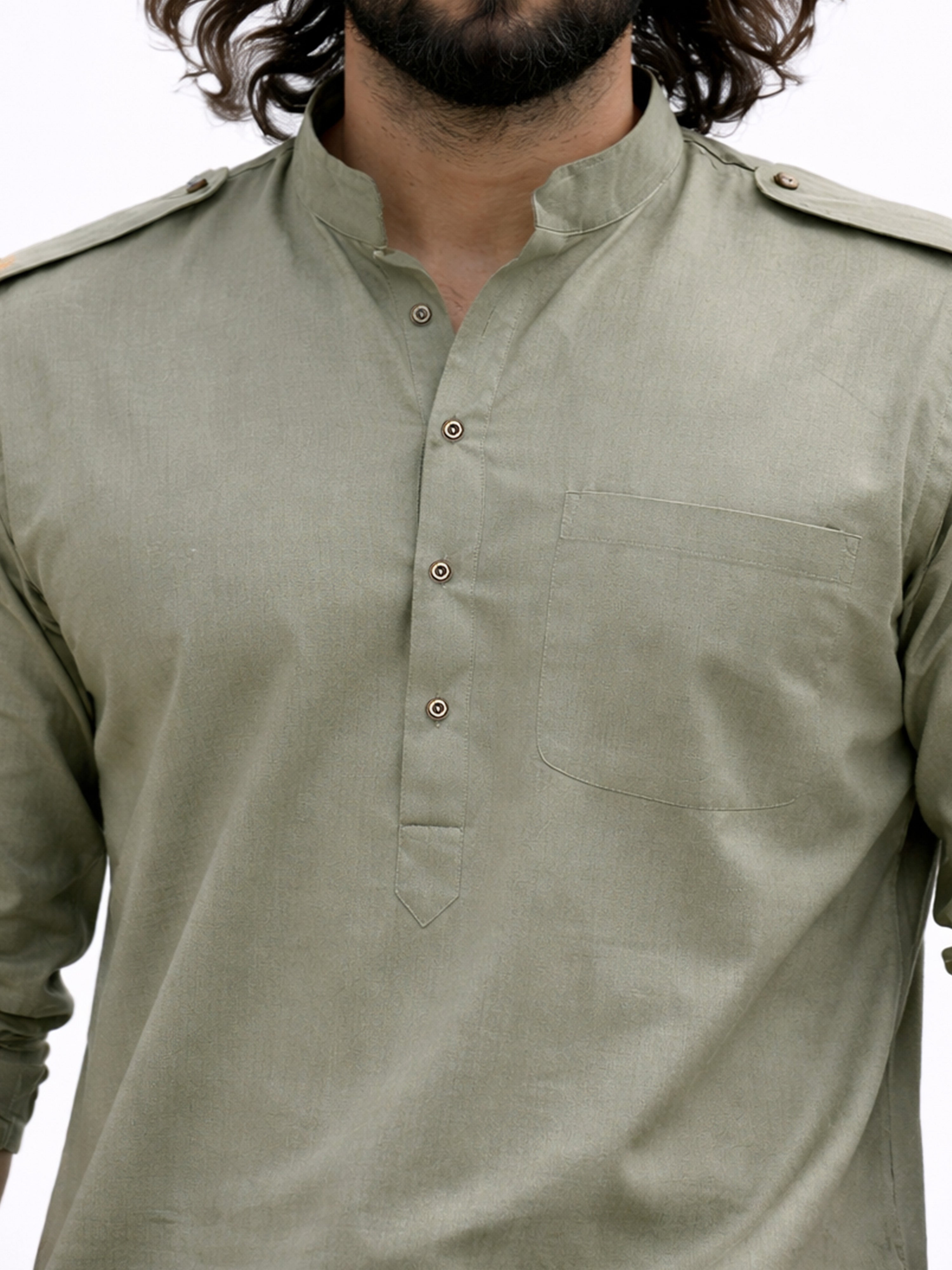 Green kurta worn by a person on a white background